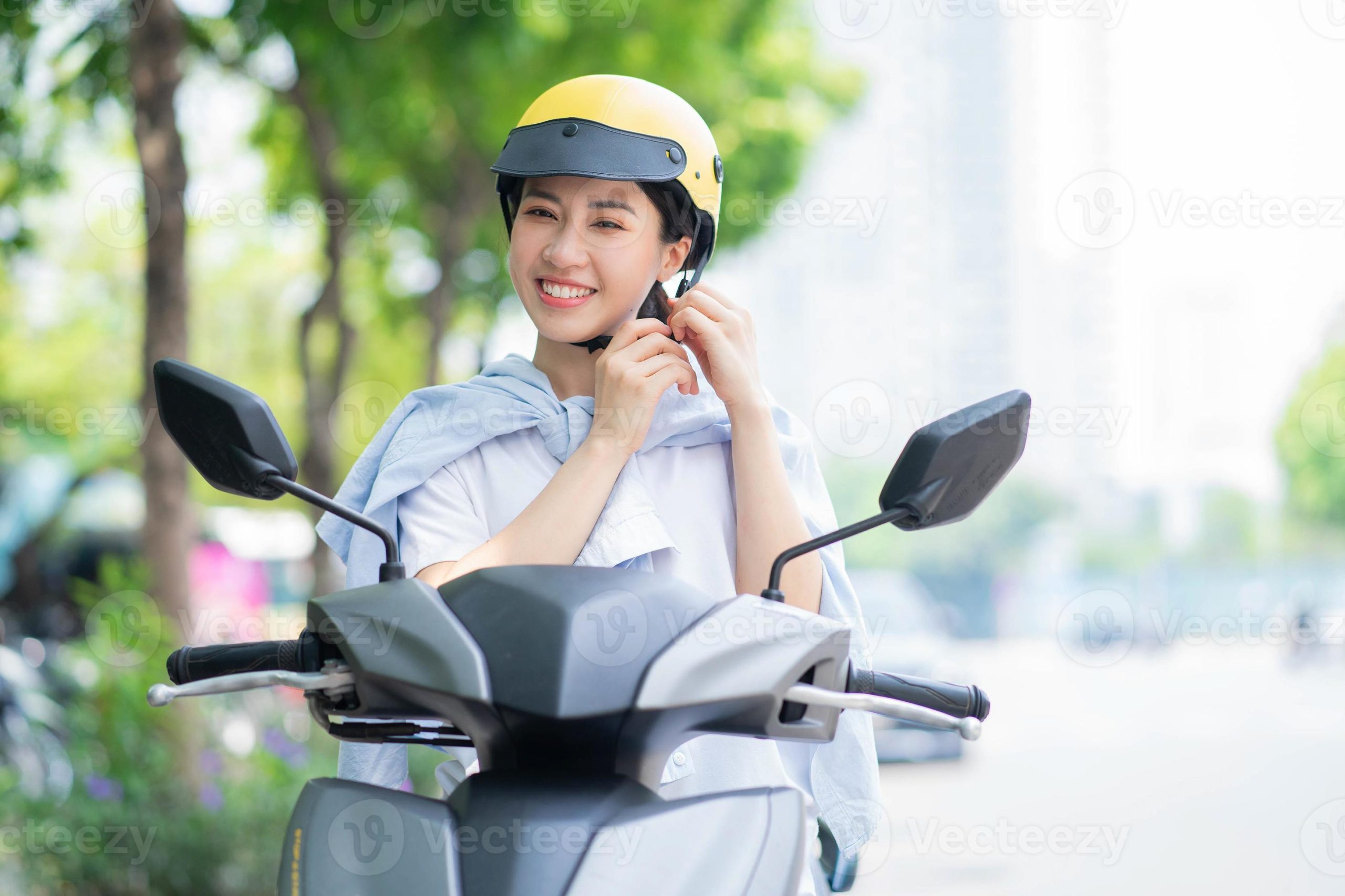 of-young-asian-woman-driving-motorbike-photo